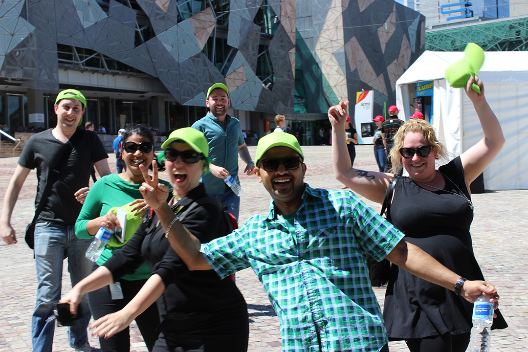group-picture happy group with a green hat in a group picture