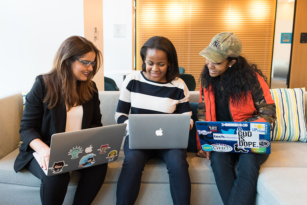 Team members collaborating on a project during an inclusive team building session