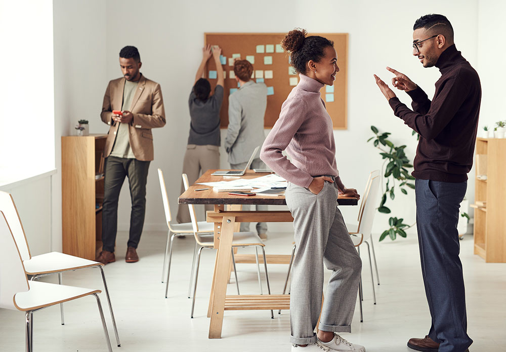 Team members engaged in a communication game at an XL Events team building session.