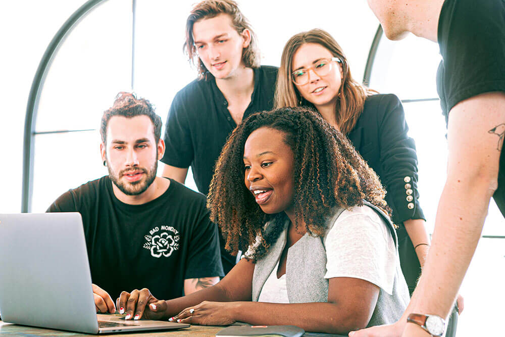 An introvert taking on a leadership role in a supportive team-building environment.