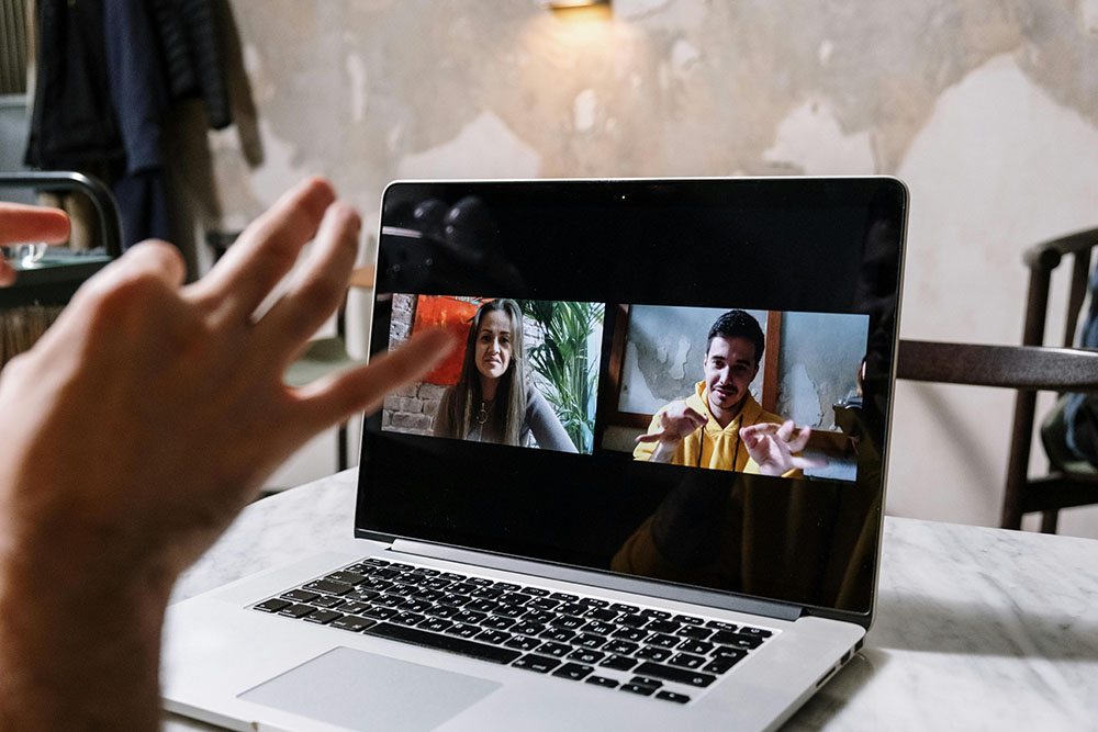 Successful remote team celebrating a completed project online.