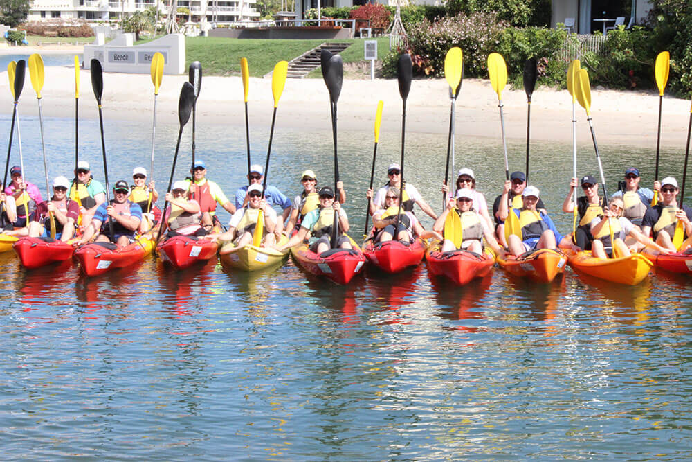 Team participating in an outdoor adventure-based team-building activity